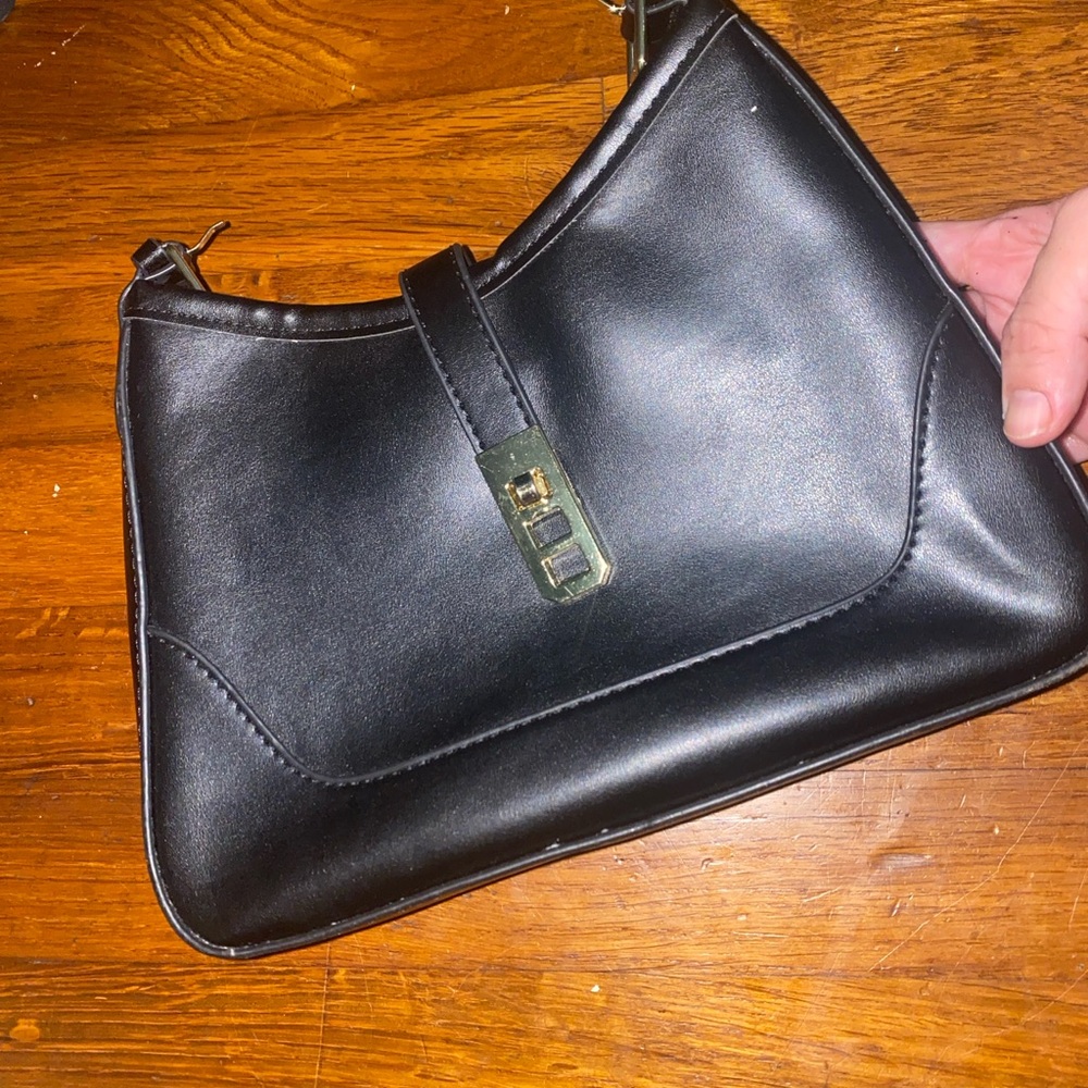 Sleek Black Handbag with Gold Accent